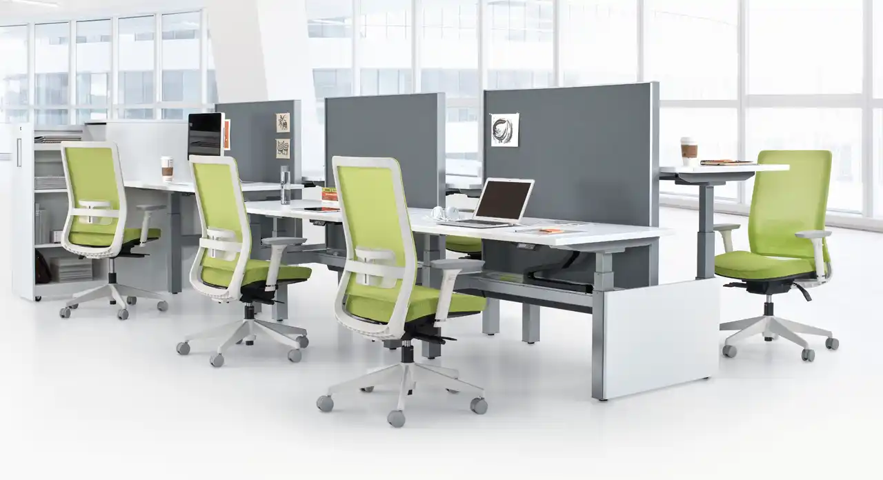 Olive grean seats and mesh back, complented with fog framed chairs being used in a open workstation environment